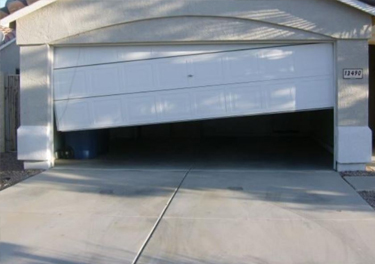 garage door off track repair in in Carson